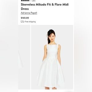 (size 2) 
Hidden back-zip closure
Side-seam pockets
Lined
100%polyester
Ivory